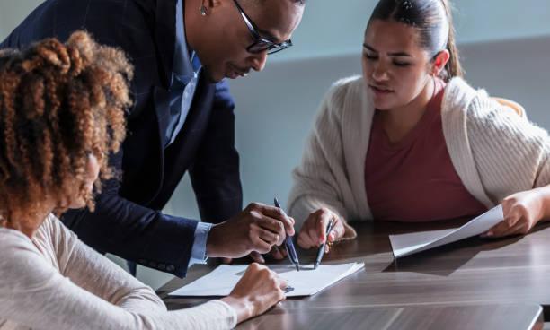a group of fiduciaries review a policy in a conference room