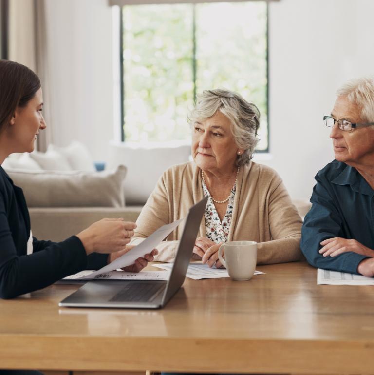 Older woman sitting at a table