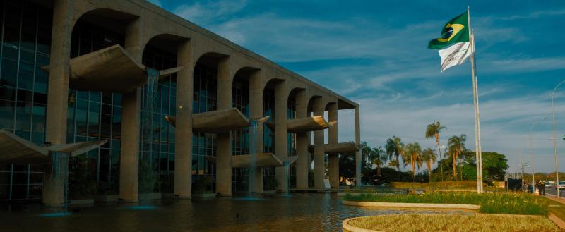 Government building with a Brazilin national flag flying outside.