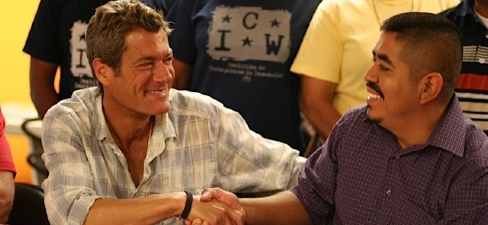 Jon Esformes (left), Operating Partner of Pacific Tomato Growers, shakes hands with the CIW’s Lucas Benitez on August 12, 2010, after signing a groundbreaking agreement to implement the Fair Food Code of Conduct on Pacific’s farms