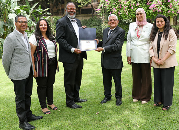Smiling group holding award