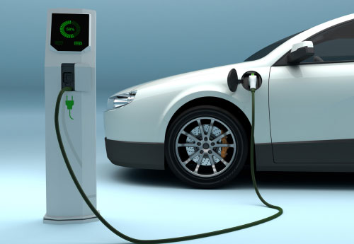 Electric car hooked up to battery charger