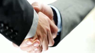 Image of two people shaking hands