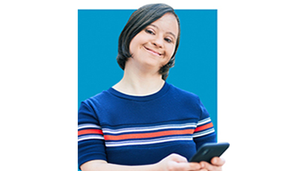 Woman in a blue striped shirt smiling and holding her phone