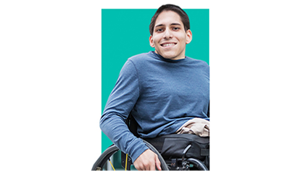 Young adult in a blue shirt sitting in his wheelchair
