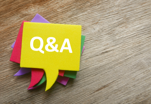 a yellow sign with the words Q&A