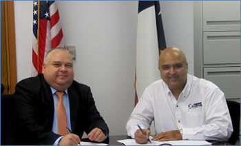 OSHA Area Director Diego Alvarado joins Ash Kamath of Jordan Foster Construction to sign a partnership to enhance workplace safety during construction at the Plaza Hotel in El Paso, Texas.