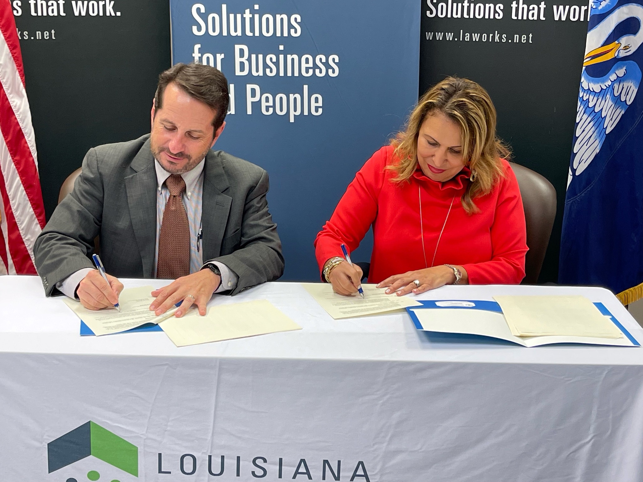 Wage and Hour Division District Director Troy Mouton in New Orleans and Secretary Ava Cates, Louisiana Workforce Commission, renew a three-year partnership to help protect Louisiana workers from misclassification.