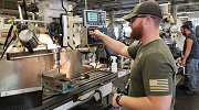 Apprentice Jacob Millichamp hones his machining skills at the Rock Island Arsenal-Joint Manufacturing and Technology Center's apprenticeship program in Illinois.