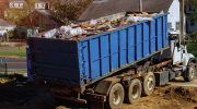 A waste truck moving materials. 
