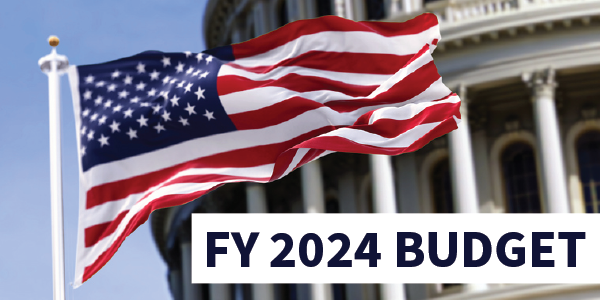 Photo of American flag flying in front of the U.S. Capitol Building. Text reads FY 2024 Budget.