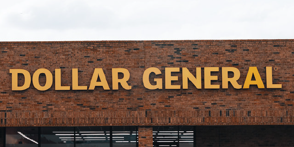 The Dollar General logo on a brick storefront.