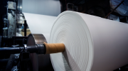 Paper spooled around a reel in a paper mill. 