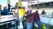 Farmworkers break for water while picking lettuce in Arizona.