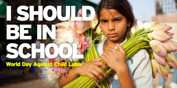 A girl holds cut flowers to sell. Text reads: I should be in school. World Day Against Child Labor