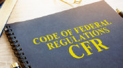 A notebook labeled Code of Federal Regulations, CFR
