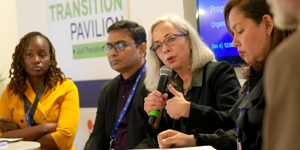 https://www.dol.gov/sites/dolgov/files/OPA/newsletter/2023/12/231207-COP28_600.png Thea Lee seated with a microphone and speaking on a panel with four other people in front of a sign that reads, "Welcome to the Just Transition Pavilion."