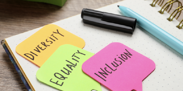 Sticky Notes on an open planner read: Diversity. Equality. Inclusion. 