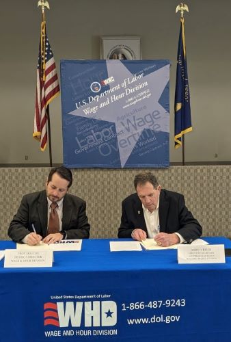 Wage and Hour District Director Troy Mouton and Executive Secretary for the Southeast Louisiana Building and Construction Trades Council Andy O’Brien sign a three-year agreement to establish a partnership to protect construction workers and promote compliance with federal laws.