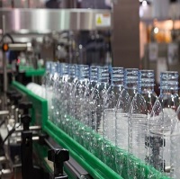 clear plastic bottles on a conveyer machine