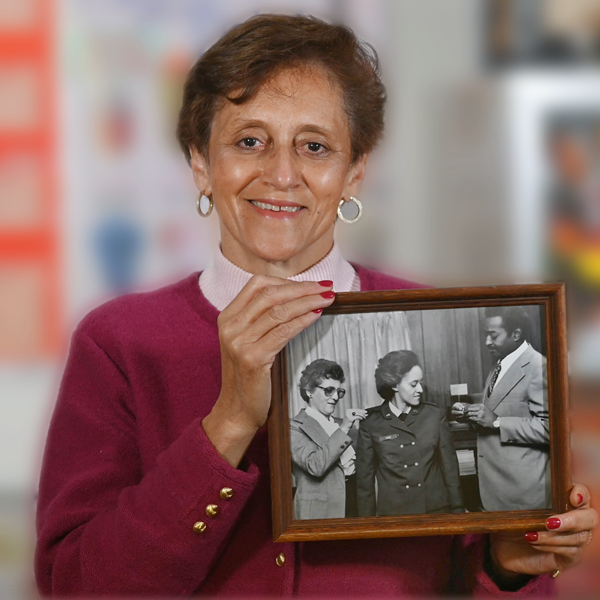 Veteran Florence Cruz poses with her framed promotion picture. 