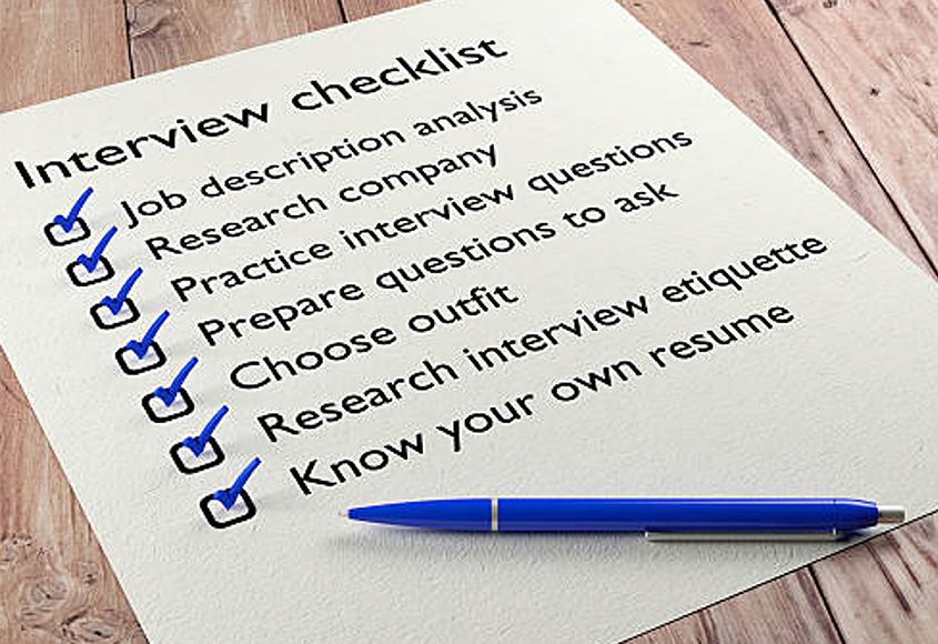 Interview checklist on paper with pen