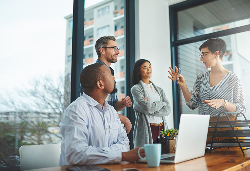 Several people in an office collaborating