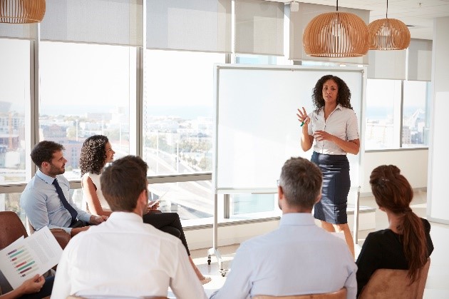 professional woman presenting to group