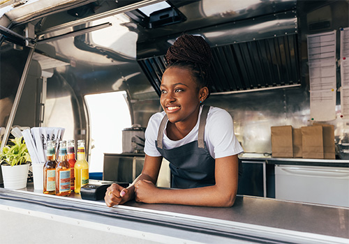 girl working at a food truck