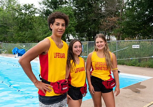 young lifeguard workers at a pool