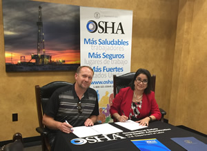 Elizabeth Linda Routh, OSHA area director, Lubbock Area Office and John R. Fehr, president of the Fehr’s Metal Building Construction, LLC sign a two-year alliance renewal agreement at the Fehr’s facility in Seminole, Texas.