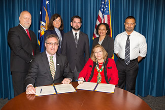 AUCD executive director Andrew Imparato (left) and ODEP Deputy Assistant Secretary Jennifer Sheehy signed the alliance alongside representatives at the Department of Labor, (left to right) Michael Gamel-McCormick, Carol Dunlap, Richard Davis, Janet Brown and Juston Locks. 
