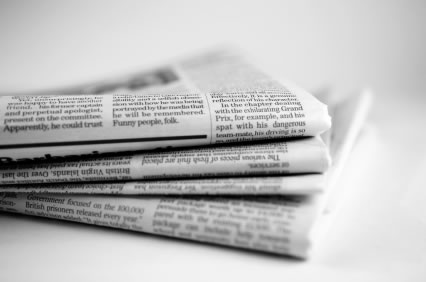Image of four folded-up newspapers
