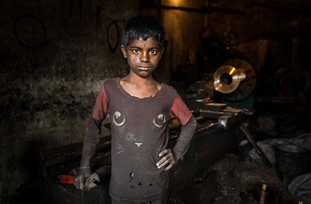 Copyright GMB Akash. Shakib, age 12, works from early morning to late evening in a rickshaw parts factory to support his family. Bangladesh. March 13, 2018.