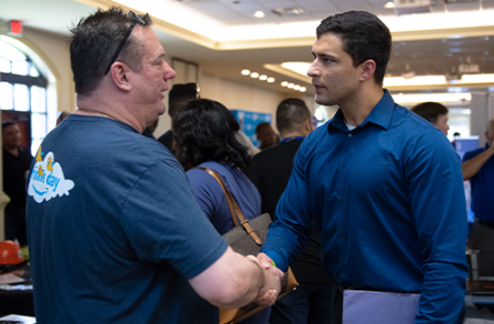 two men are shaking hands