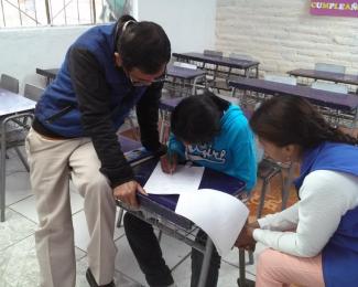 Luis (pictured here practicing an exam) discovered his aptitude for math with the help of the DOL-funded “Espacios Para Crecer” program. Photo by Partners of the Americas.